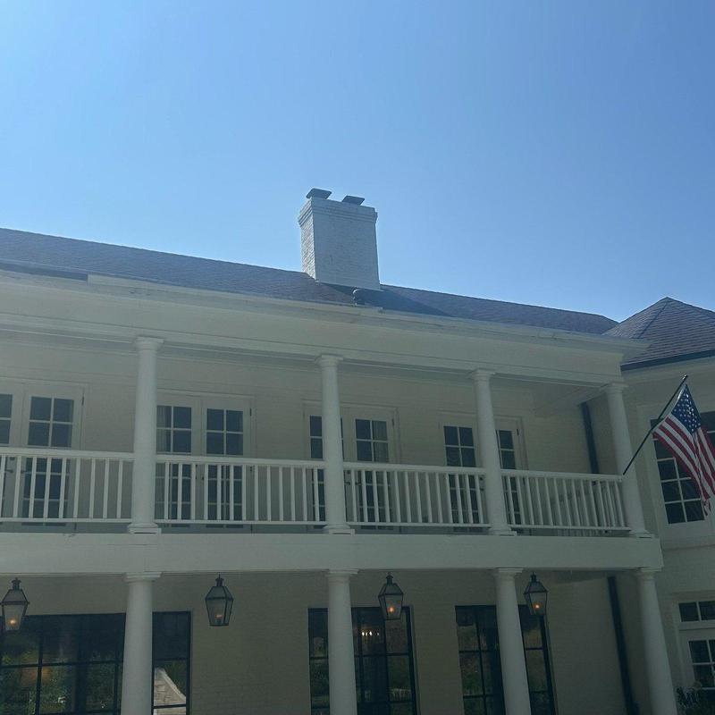 Dormer and soffit roofline trim on white home