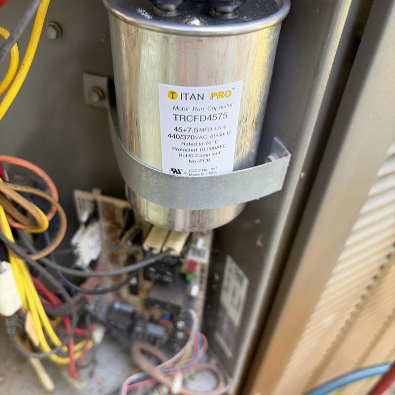 Motor run capacitor in HVAC unit wiring panel Motor run capacitor in HVAC unit wiring panel