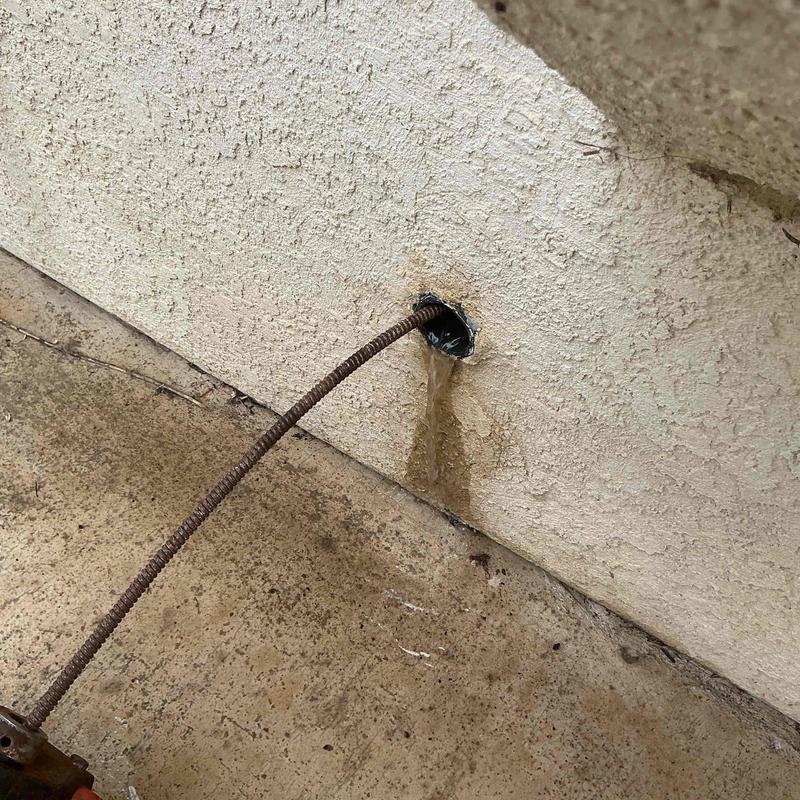Kitchen drain line snaking clearing blockage debris buildup