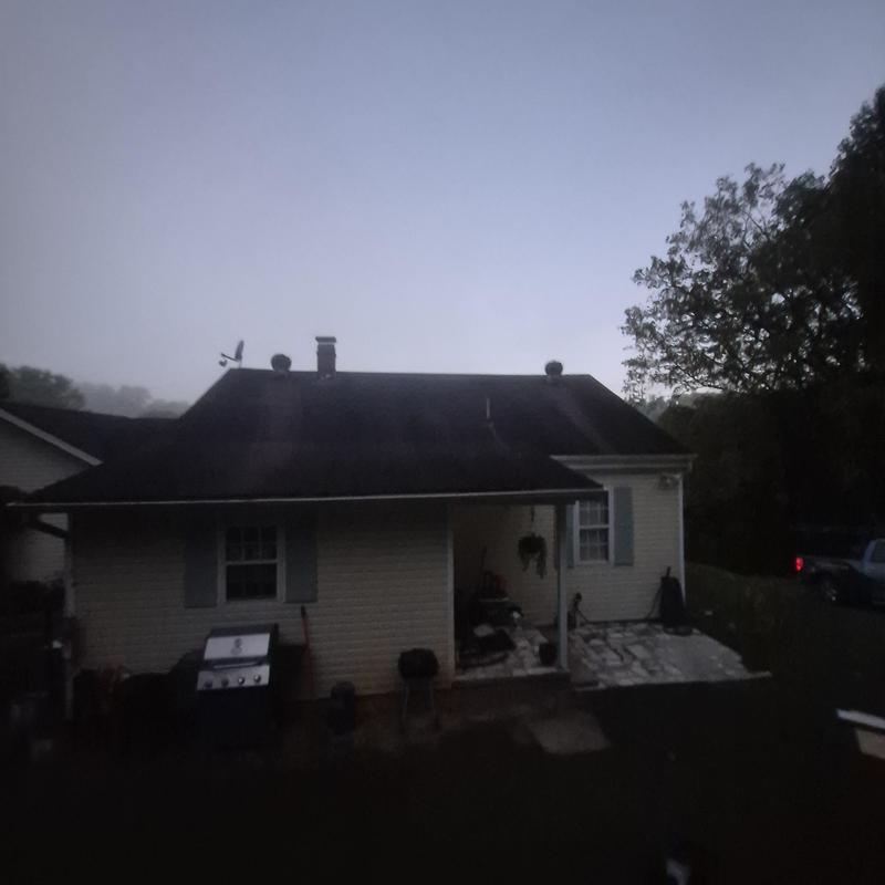 Asphalt shingle roof with chimney before replacement Asphalt shingle roof with chimney before replacement