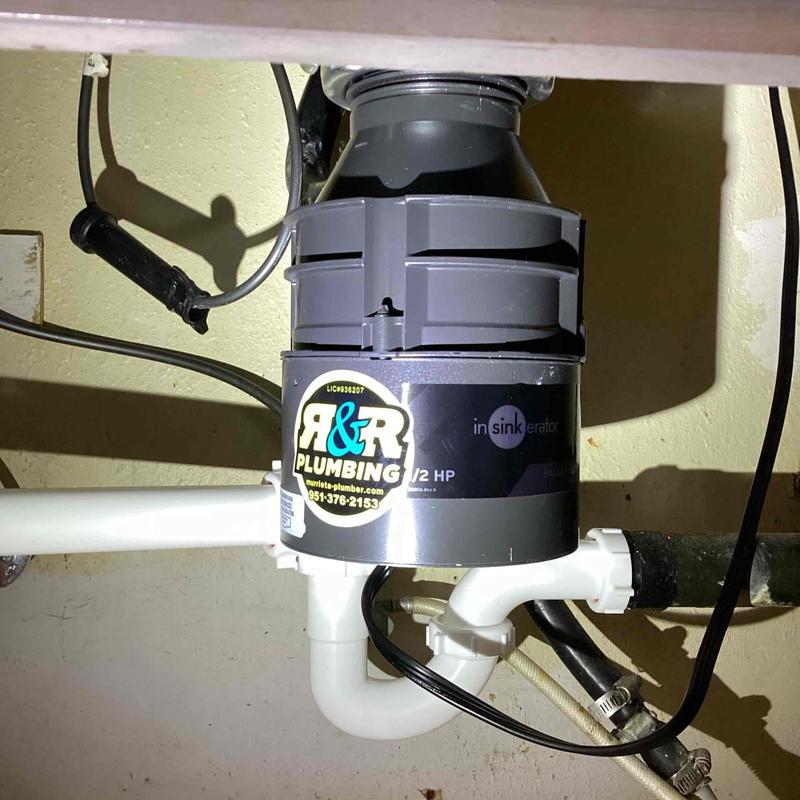 Garbage disposal unit under kitchen sink installation