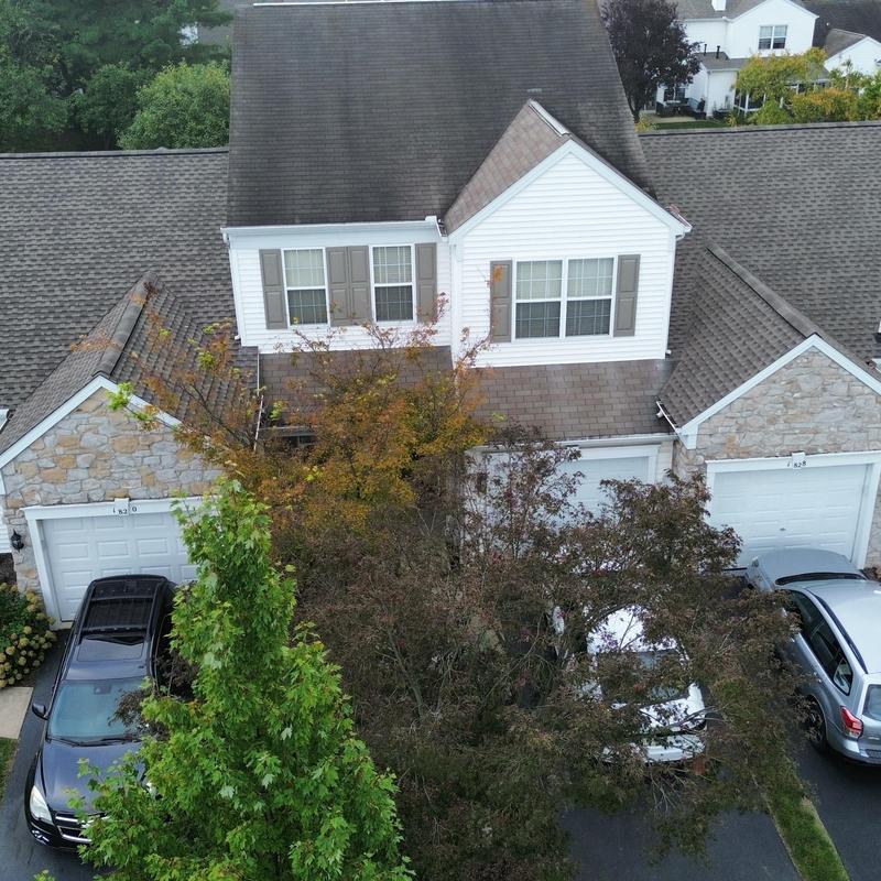 Asphalt shingle roof wind damage on townhome upper slopes Asphalt shingle roof wind damage on townhome upper slopes
