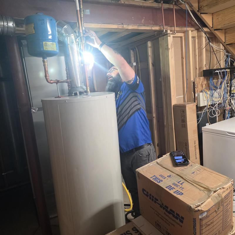 Water heater flushing and maintenance in basement