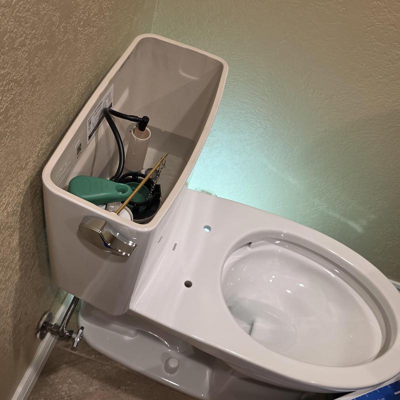Toilet tank interior with flush components installation