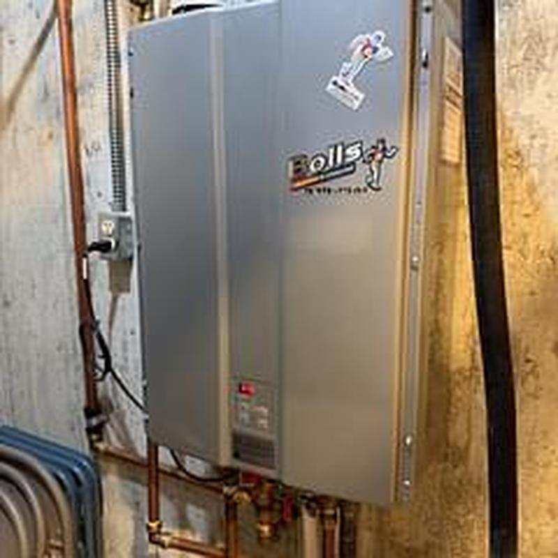 Tankless water heater unit in basement