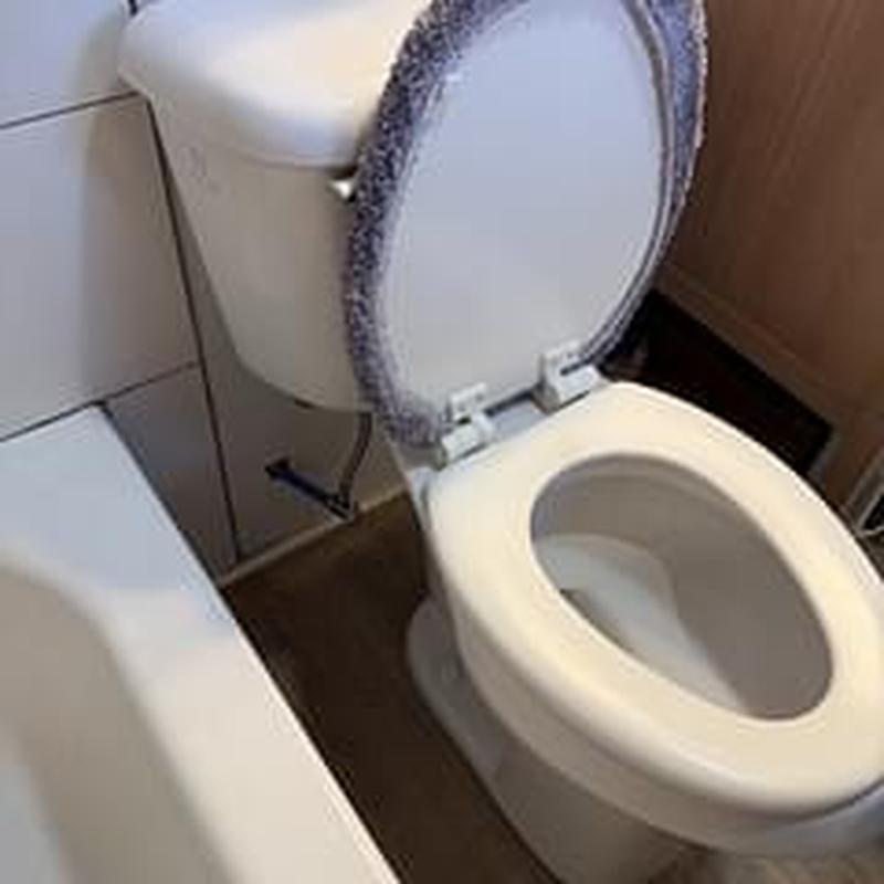 Mansfield elongated ADA toilet installation in bathroom