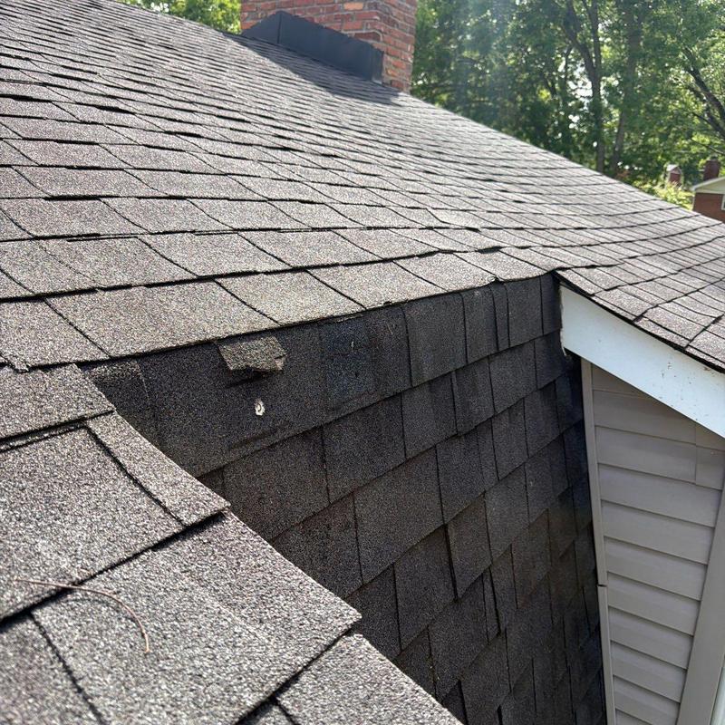 Asphalt shingle roof with hail damage inspection