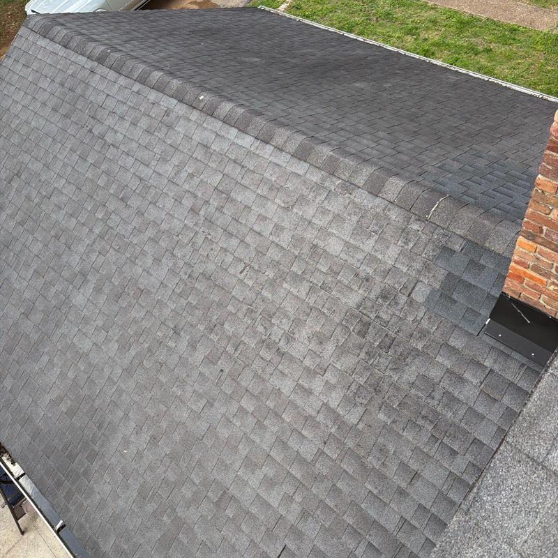 Asphalt shingle roof showing wear and discoloration