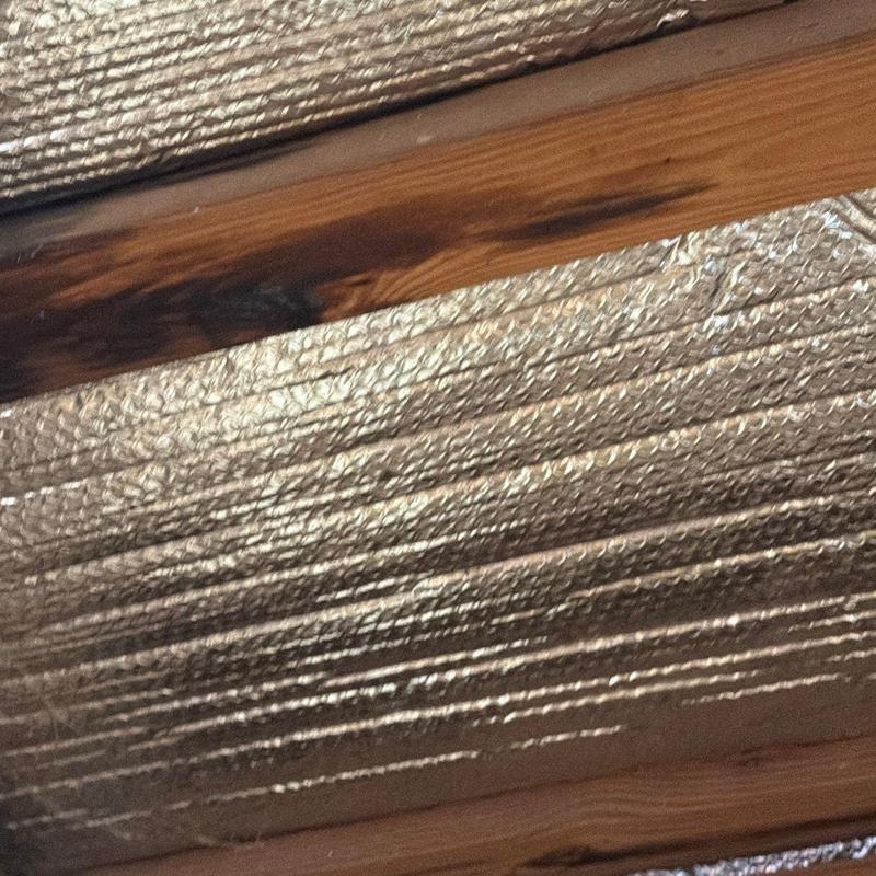 Roof framing wood with moisture and mold damage