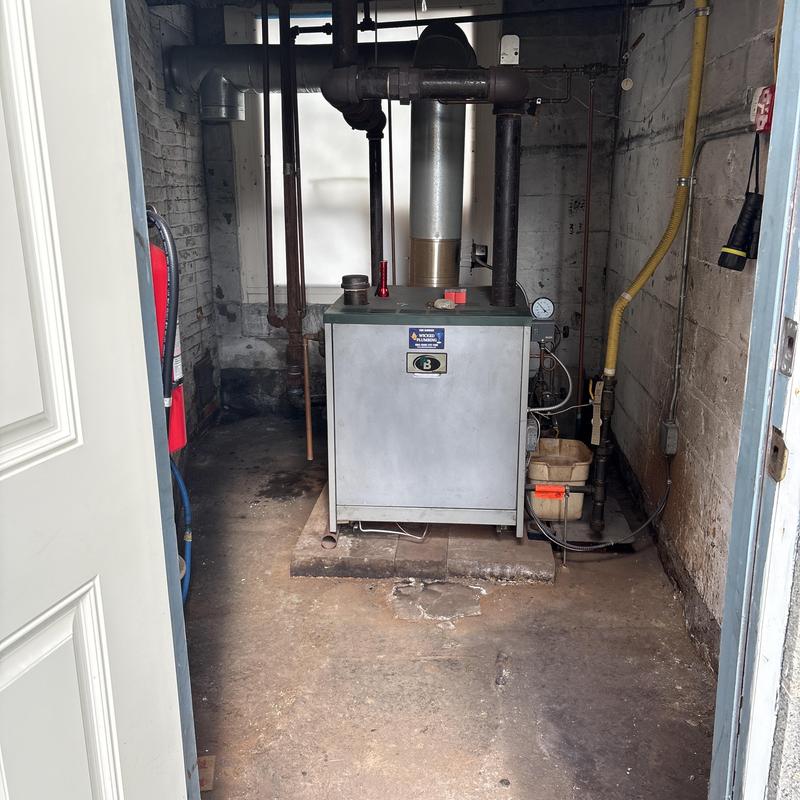 Hydronic boiler with piping in basement room Hydronic boiler with piping in basement room