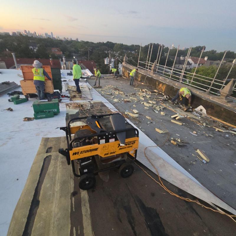 Low-slope concrete roof replacement with debris removal Low-slope concrete roof replacement with debris removal