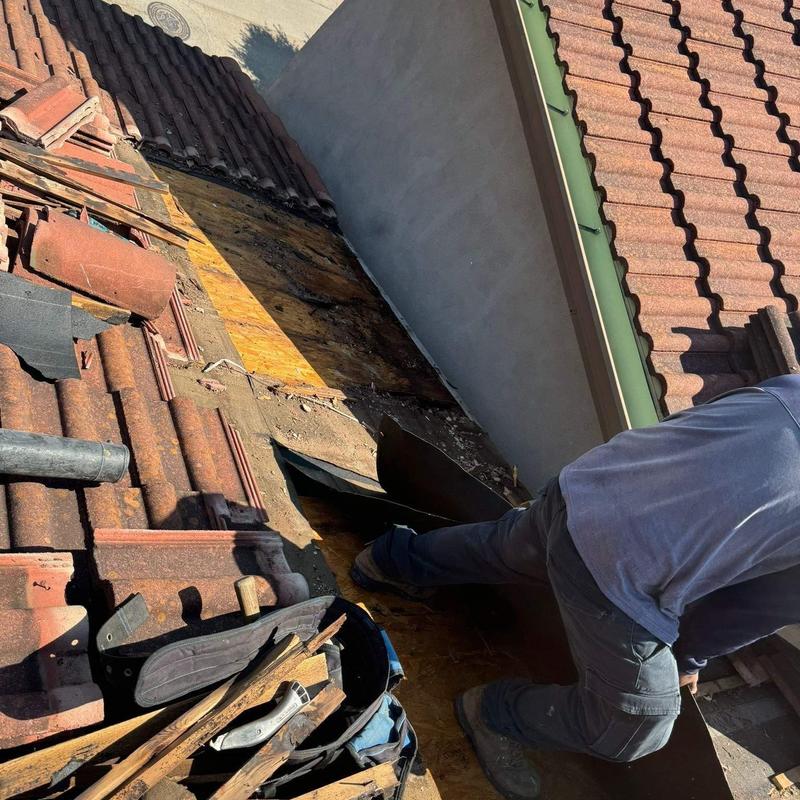Tile roof with damaged underlayment removal Tile roof with damaged underlayment removal