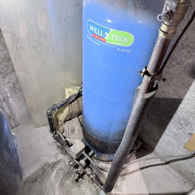 Well tank replacement with system testing in basement Well tank replacement with system testing in basement