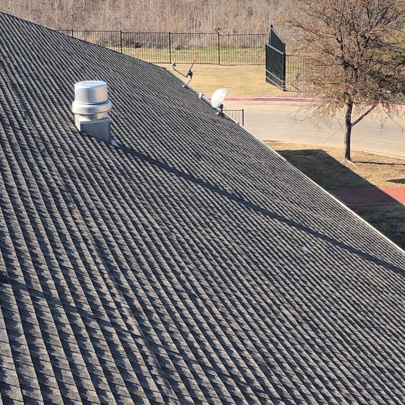 Asphalt shingle roof with repaired storm damage in Texas Asphalt shingle roof with repaired storm damage in Texas