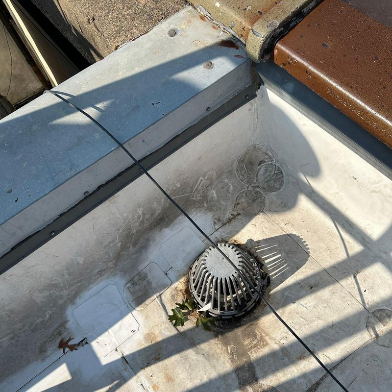 Concrete roof drain on flat commercial roofing system Concrete roof drain on flat commercial roofing system