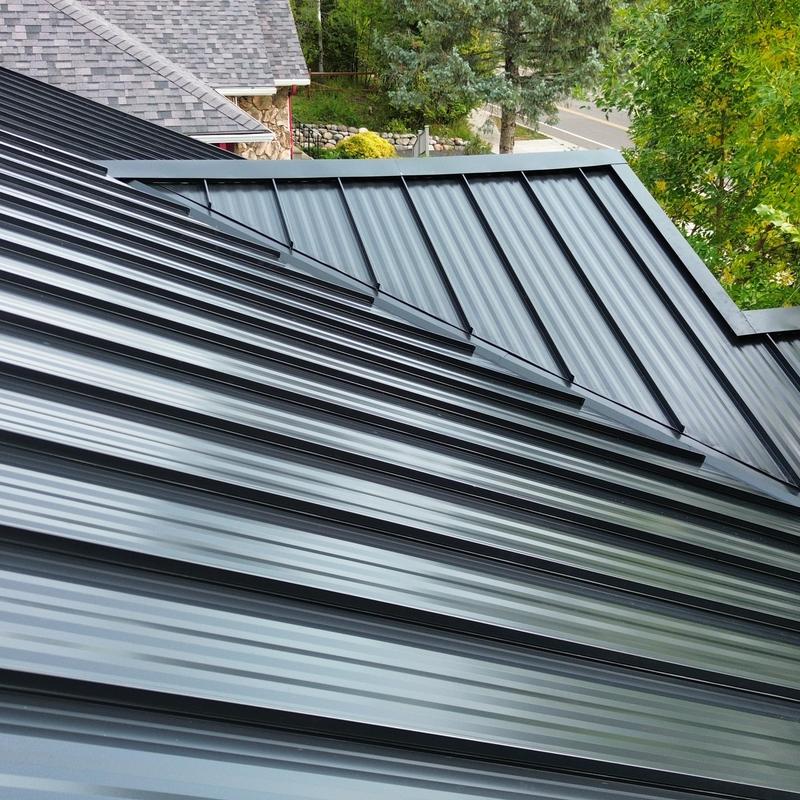 Standing seam steel roof with striated panels