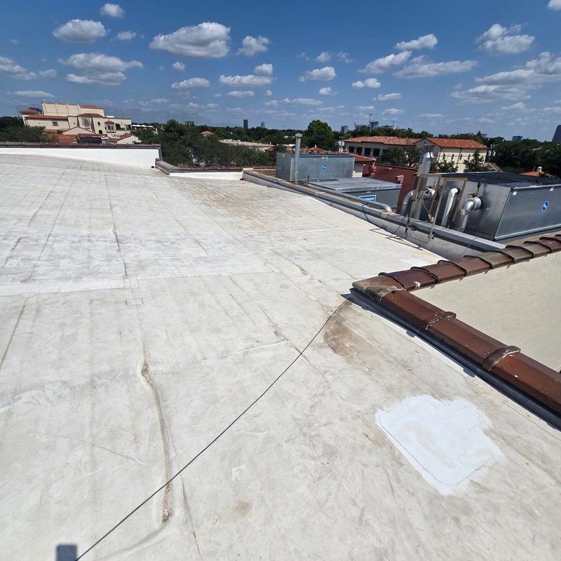 Concrete roof replacement with HVAC units visible Concrete roof replacement with HVAC units visible