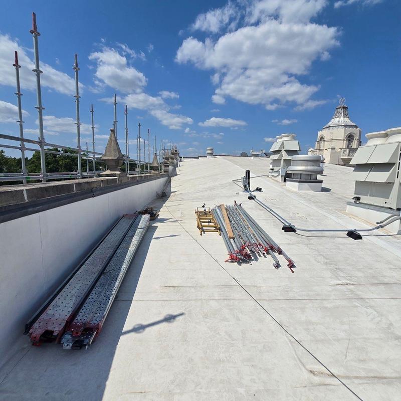Concrete commercial roof with scaffolding and equipment Concrete commercial roof with scaffolding and equipment