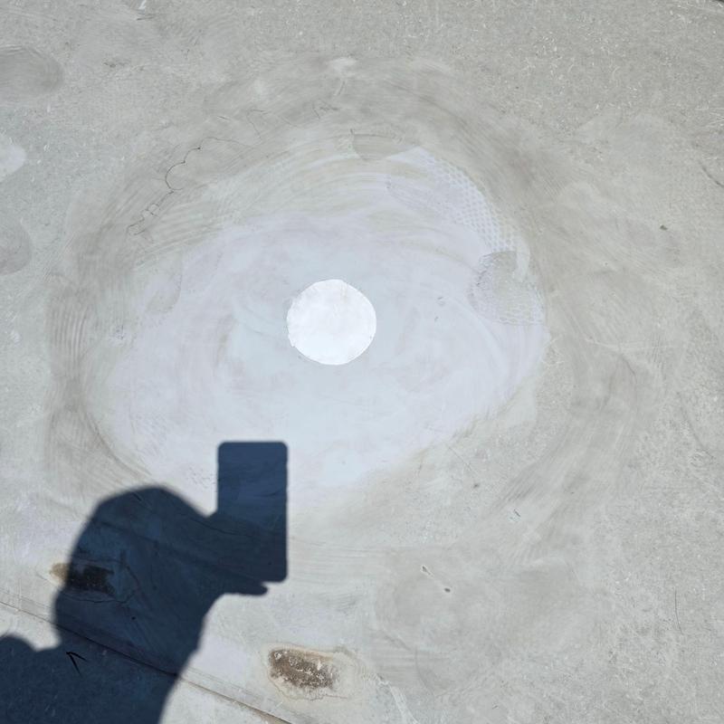 Concrete roof drain patch on commercial roof surface Concrete roof drain patch on commercial roof surface