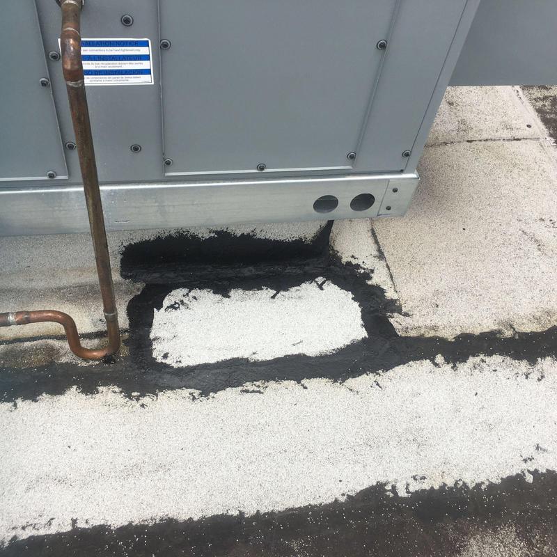 Concrete roof patching near rooftop HVAC unit base Concrete roof patching near rooftop HVAC unit base