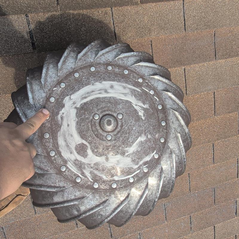Turbine roof vent on asphalt shingle roof