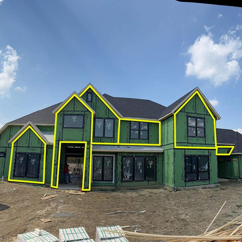 House sheathing installation with window openings outlined House sheathing installation with window openings outlined