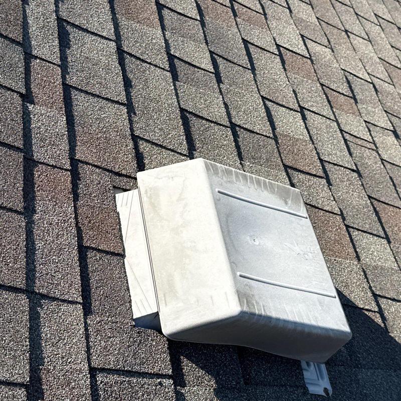 Roof vent on shingle roof after storm damage repair Roof vent on shingle roof after storm damage repair