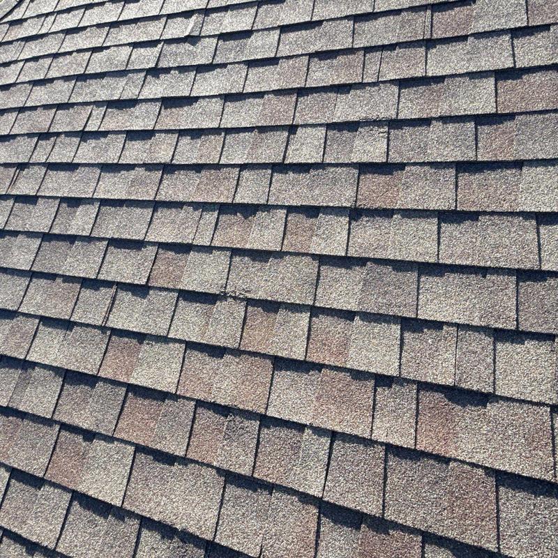 Shingle roof after wind and hail damage repair Shingle roof after wind and hail damage repair