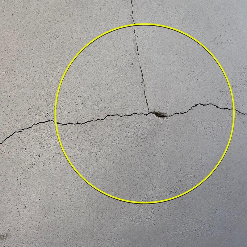 Concrete wall crack with leak damage close-up Concrete wall crack with leak damage close-up