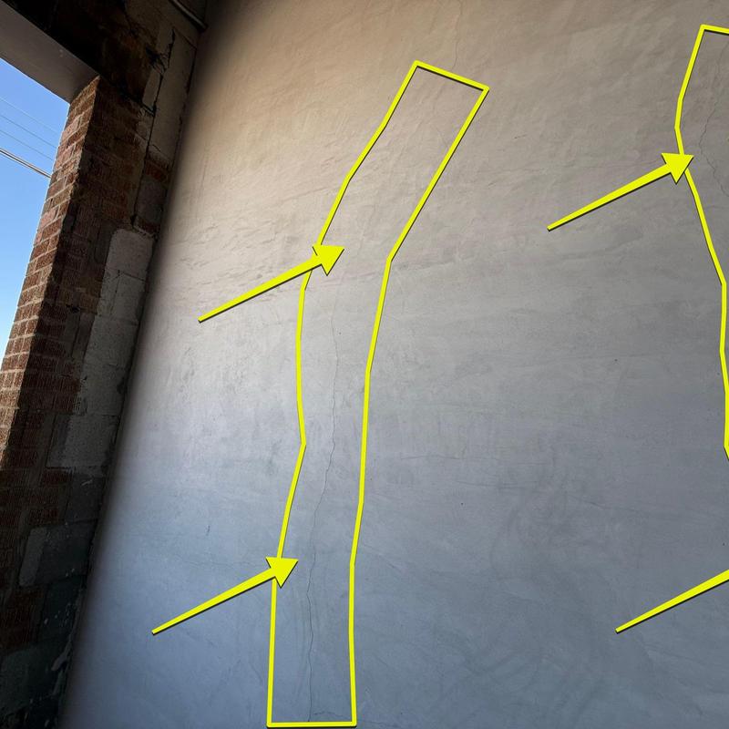 Concrete wall with cracks and leak damage outlined Concrete wall with cracks and leak damage outlined