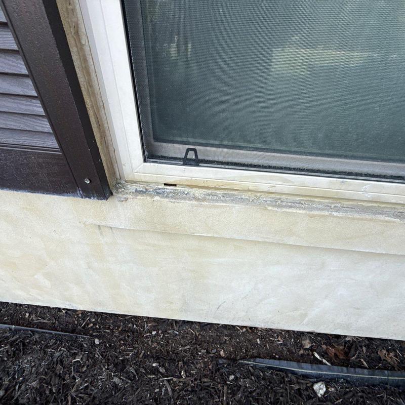 Concrete window sill with surface wear and repair Concrete window sill with surface wear and repair