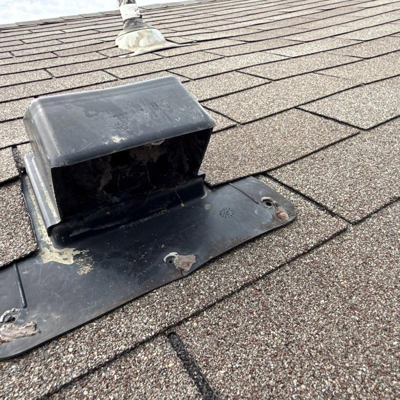 Roof vent flashing on asphalt shingle roof close-up Roof vent flashing on asphalt shingle roof close-up