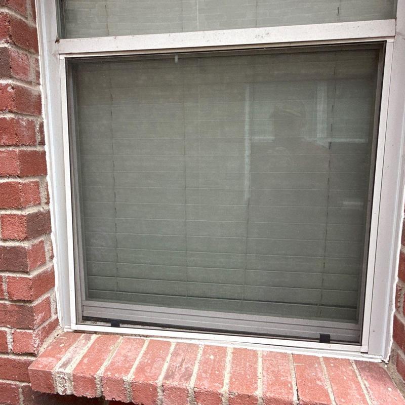 Window screen installation on brick home exterior Window screen installation on brick home exterior