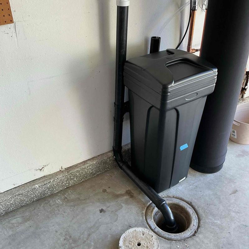 ABS piping connected to floor cleanout with vent assembly