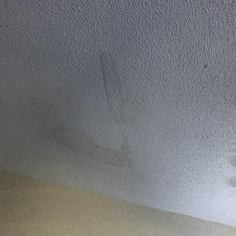 Ceiling texture with water damage stain
