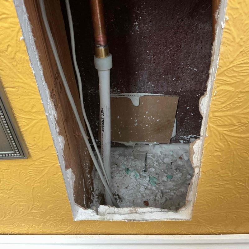 12 PEX water line replacing copper pipe in wall cavity