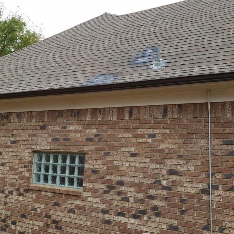 Shingle roof with marked hail and wind damage
