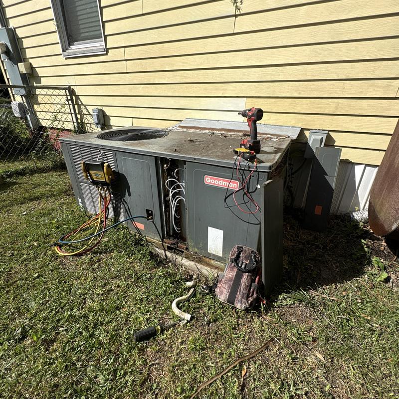 Goodman outdoor AC unit with diagnostic tools attached