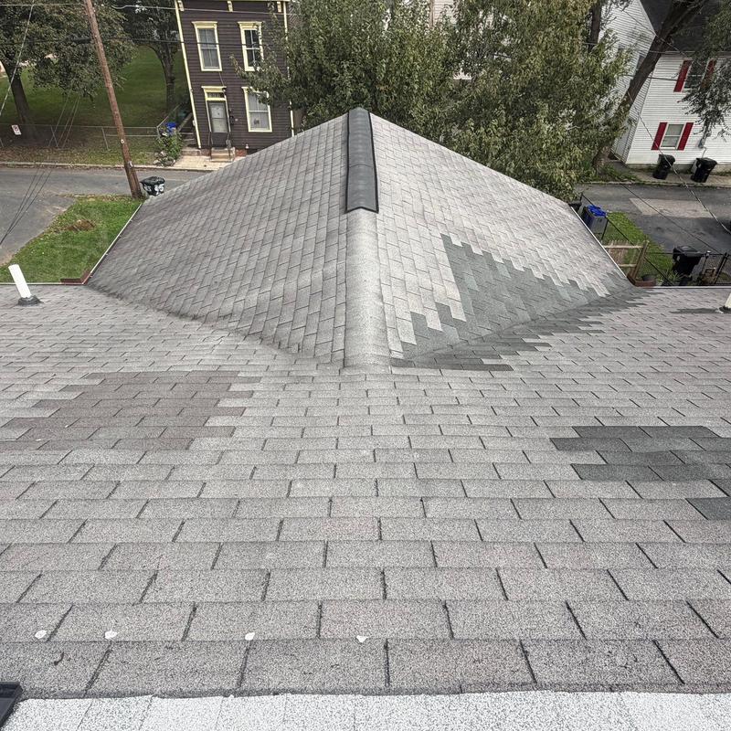 Roof with grey architectural shingles and ridge vent Roof with grey architectural shingles and ridge vent