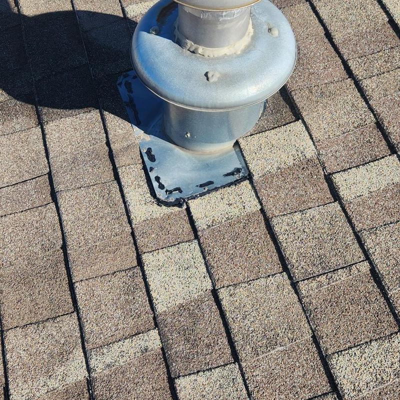 Roof vent flashing on asphalt shingle roof