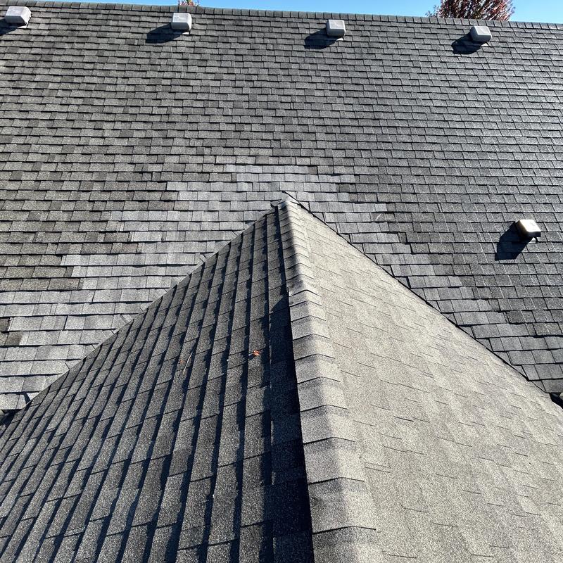 Roof valley with new shingles on dormer slope