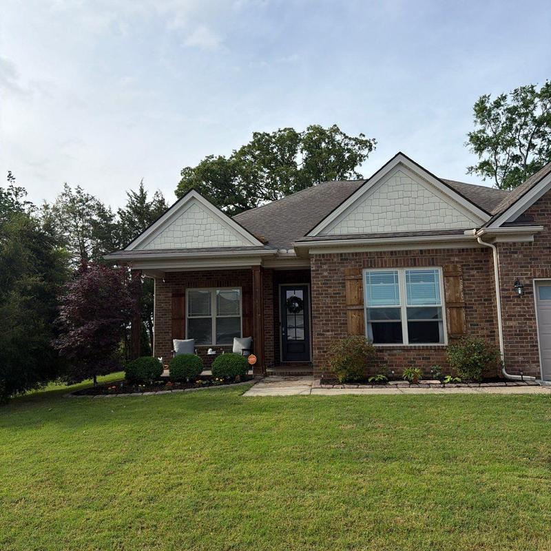 Asphalt shingle roof hail damage inspection on home exterior