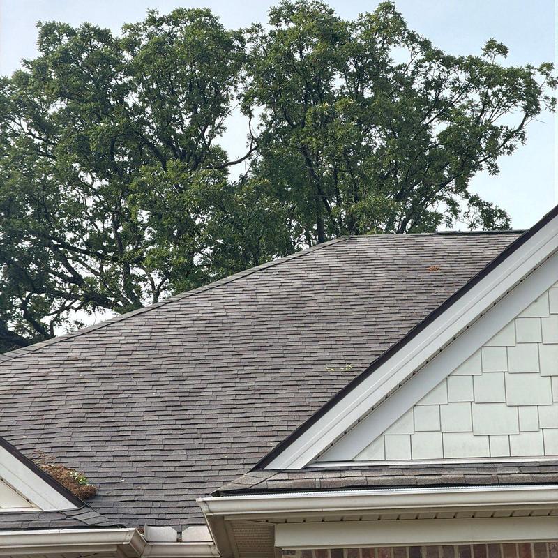 Asphalt shingle roof inspected for hail damage and wear