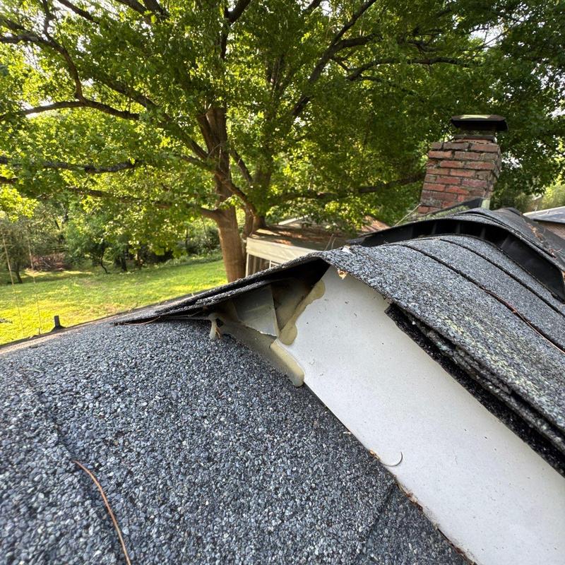 Asphalt shingle roof edge lifting, potential hail damage