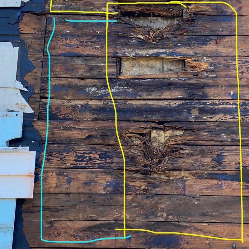 Wood sheathing with water damage and rot decay