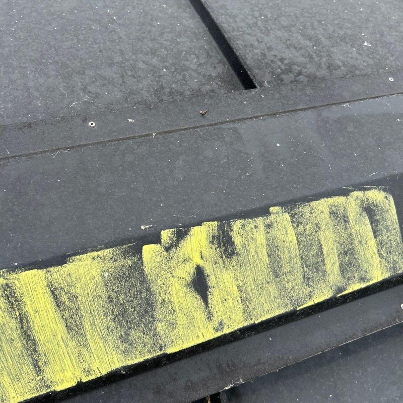 Commercial roof flashing with yellow chalk markings