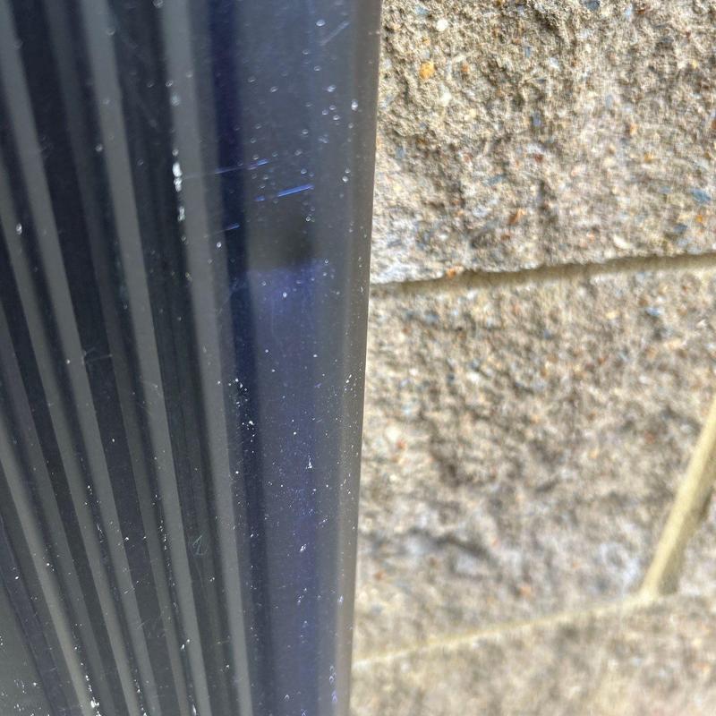 Metal roof flashing close-up with minor wear
