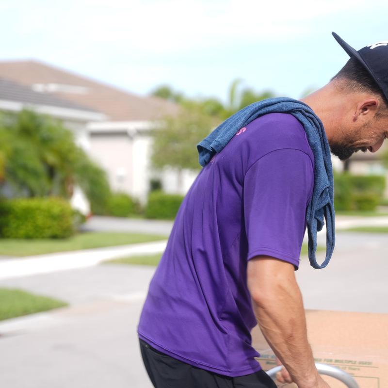 Moving boxes handled by professional mover outdoors