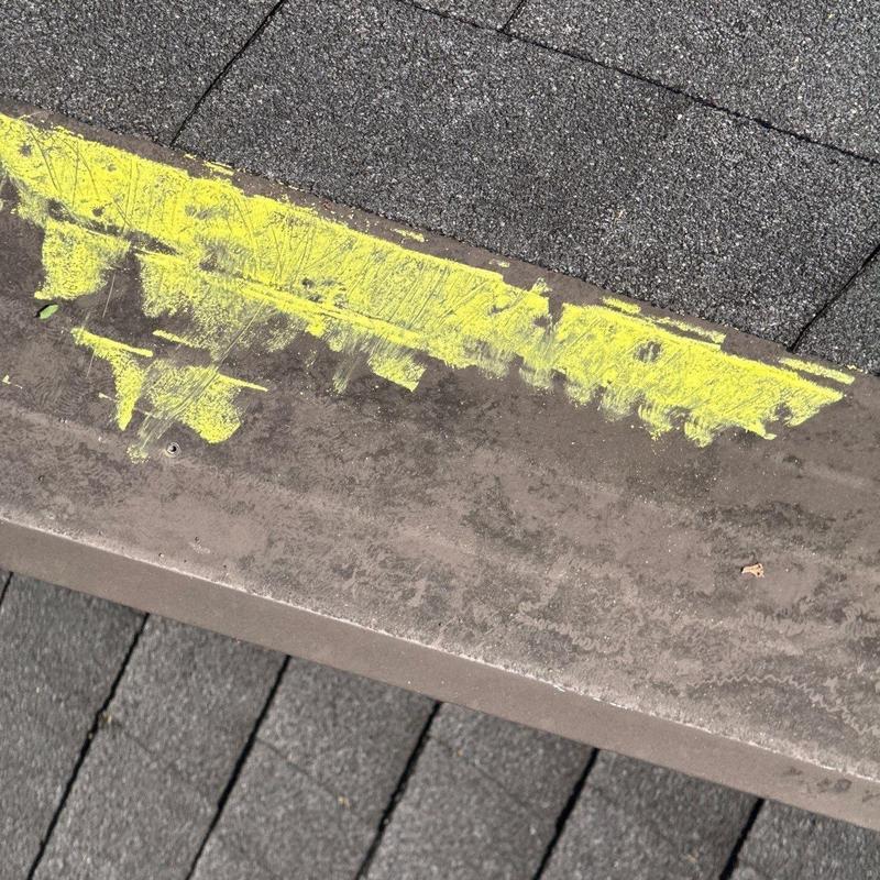 Metal roof drip edge with yellow chalk markings