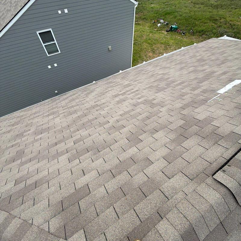 Asphalt shingle roof with hail damage inspection